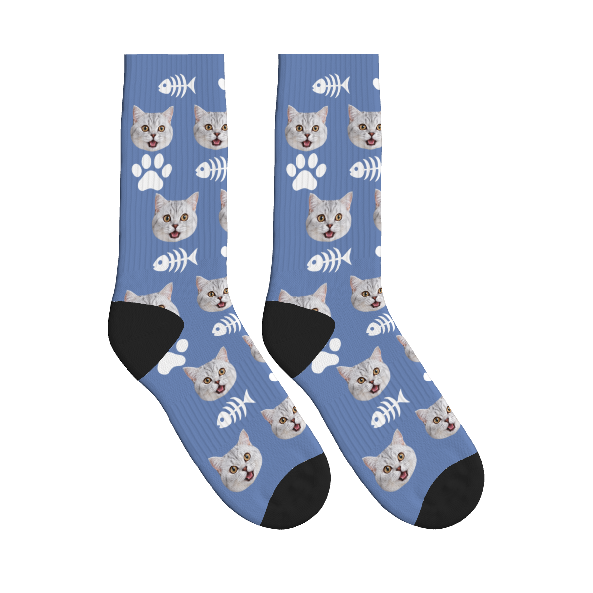 Finished slate blue cat face socks with white fishbones, paw prints and black heels and toes
